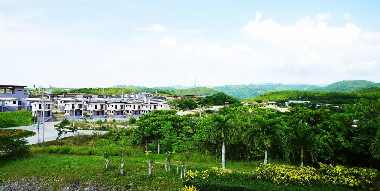 Amoa completed homes on rolling green terrain in Compostela, Cebu